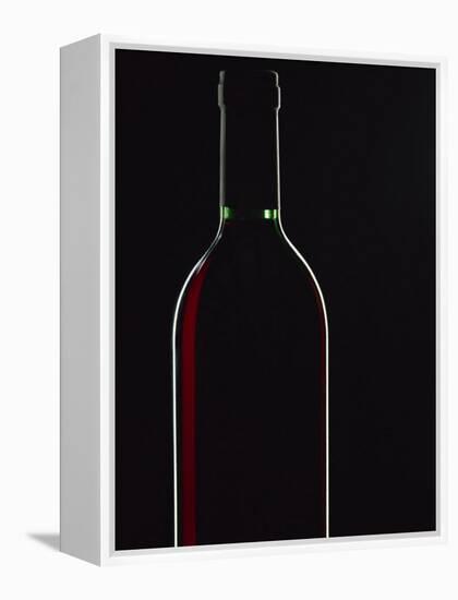 Backlit Shot of a Bottle of Red Wine-Lee Frost-Framed Premier Image Canvas