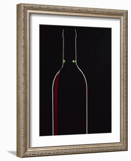 Backlit Shot of a Bottle of Red Wine-Lee Frost-Framed Photographic Print