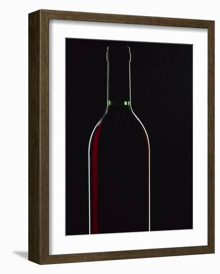 Backlit Shot of a Bottle of Red Wine-Lee Frost-Framed Photographic Print