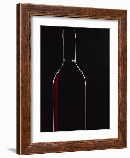 Backlit Shot of a Bottle of Red Wine-Lee Frost-Framed Photographic Print