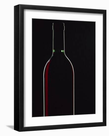 Backlit Shot of a Bottle of Red Wine-Lee Frost-Framed Photographic Print