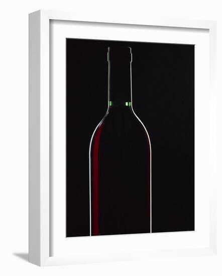 Backlit Shot of a Bottle of Red Wine-Lee Frost-Framed Photographic Print