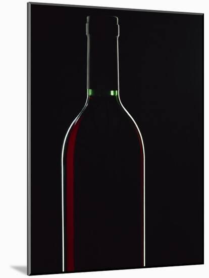 Backlit Shot of a Bottle of Red Wine-Lee Frost-Mounted Photographic Print