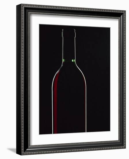 Backlit Shot of a Bottle of Red Wine-Lee Frost-Framed Photographic Print