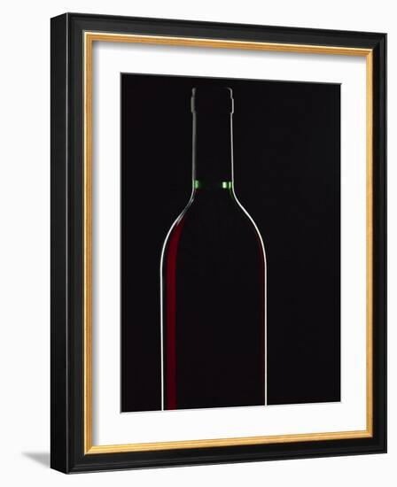 Backlit Shot of a Bottle of Red Wine-Lee Frost-Framed Photographic Print