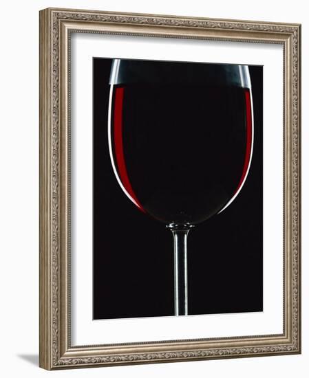Backlit Shot of a Glass of Red Wine-Lee Frost-Framed Photographic Print