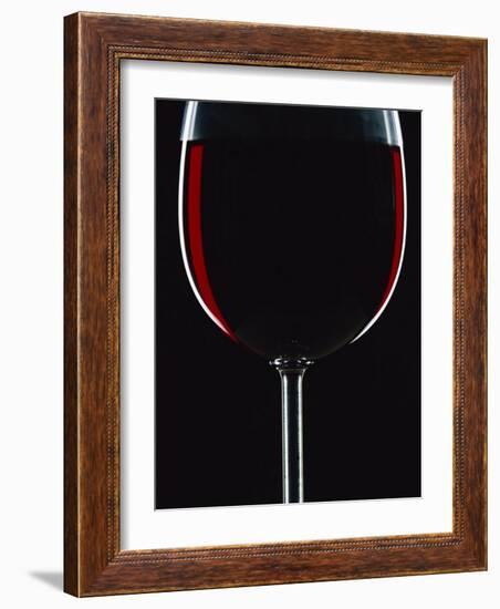 Backlit Shot of a Glass of Red Wine-Lee Frost-Framed Photographic Print