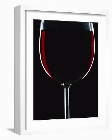 Backlit Shot of a Glass of Red Wine-Lee Frost-Framed Photographic Print