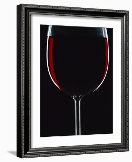 Backlit Shot of a Glass of Red Wine-Lee Frost-Framed Photographic Print