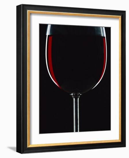 Backlit Shot of a Glass of Red Wine-Lee Frost-Framed Photographic Print