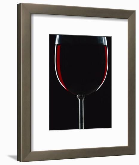 Backlit Shot of a Glass of Red Wine-Lee Frost-Framed Photographic Print