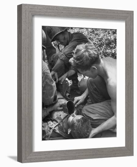 Badly Wounded Medic Being Given Water While Soldier in Background Cuts Clothing from His Wounds-null-Framed Photographic Print