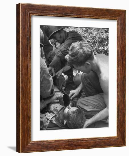 Badly Wounded Medic Being Given Water While Soldier in Background Cuts Clothing from His Wounds-null-Framed Photographic Print