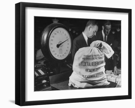 Bag of Checks Being Weighed on Scale at Bank-Herbert Gehr-Framed Photographic Print