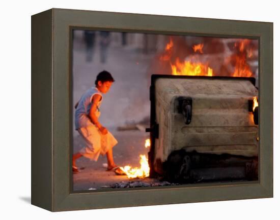 Bahraini Child Plays Near to Burning Tires and a Dumpster-null-Framed Premier Image Canvas