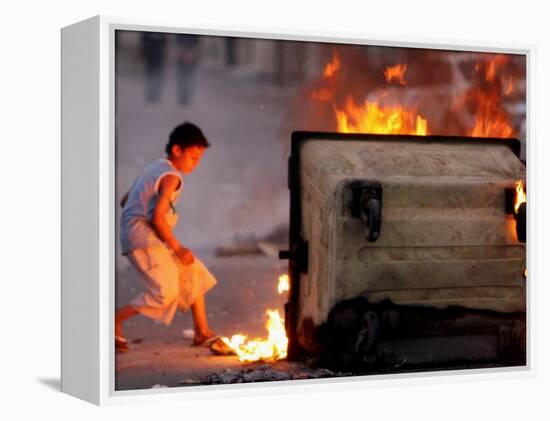 Bahraini Child Plays Near to Burning Tires and a Dumpster-null-Framed Premier Image Canvas