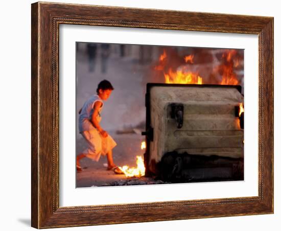 Bahraini Child Plays Near to Burning Tires and a Dumpster-null-Framed Photographic Print