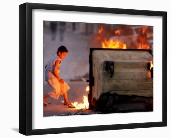 Bahraini Child Plays Near to Burning Tires and a Dumpster-null-Framed Photographic Print