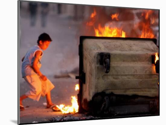 Bahraini Child Plays Near to Burning Tires and a Dumpster-null-Mounted Photographic Print