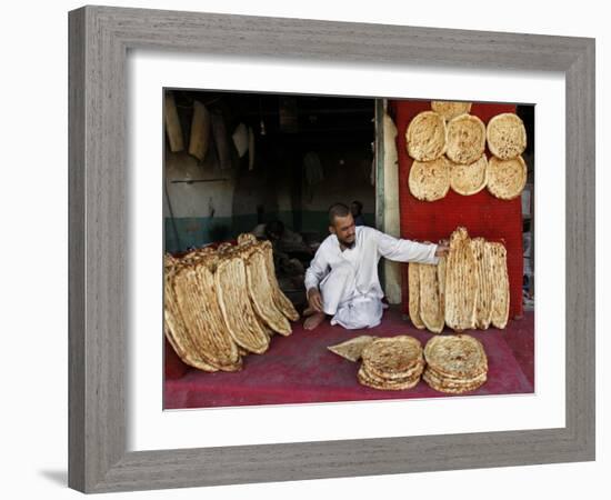 Baker Arranges Breads at His Shop in Kandahar Province, South of Kabul, Afghanistan-null-Framed Photographic Print