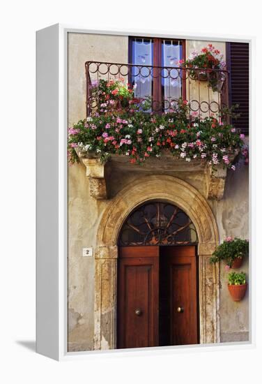 Balcony Flowers and Doorway in Pienza Tuscany Italy-Julian Castle-Framed Stretched Canvas