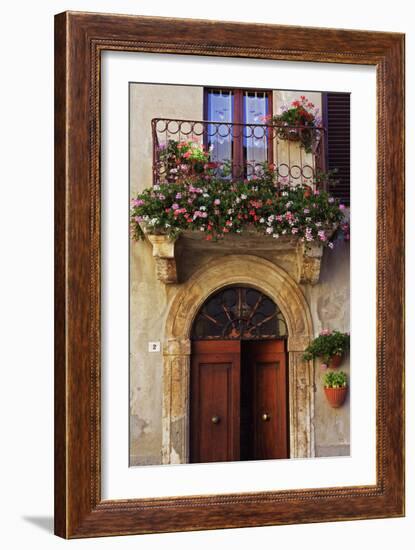 Balcony Flowers and Doorway in Pienza Tuscany Italy-Julian Castle-Framed Photo