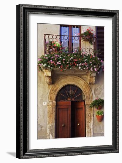 Balcony Flowers and Doorway in Pienza Tuscany Italy-Julian Castle-Framed Photo