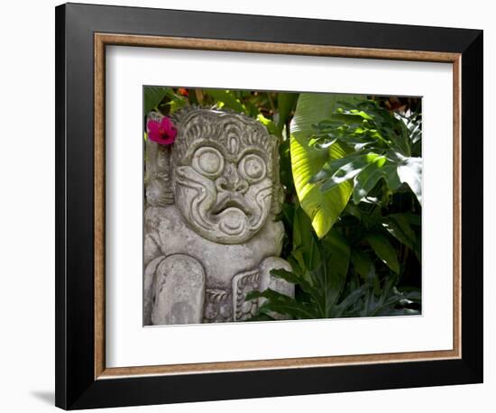 Bali, Ubud, a Stone Carving, Adorned with a Hibiscus Flower, Sits in Tropical Gardens-Niels Van Gijn-Framed Photographic Print