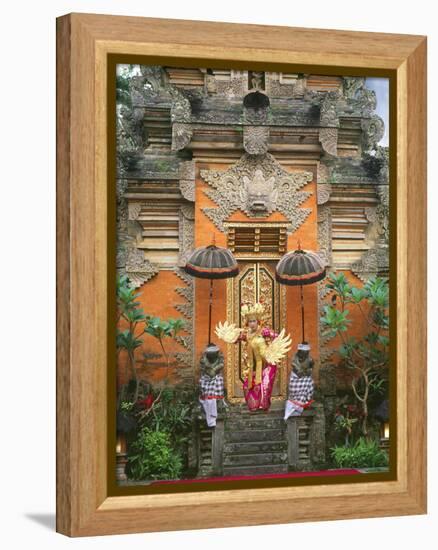 Balinese Dancer Wearing Traditional Garb Near Palace Doors in Ubud, Bali, Indonesia-Jim Zuckerman-Framed Premier Image Canvas