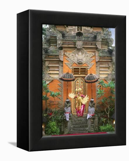 Balinese Dancer Wearing Traditional Garb Near Palace Doors in Ubud, Bali, Indonesia-Jim Zuckerman-Framed Premier Image Canvas