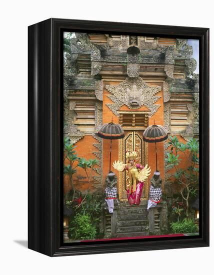 Balinese Dancer Wearing Traditional Garb Near Palace Doors in Ubud, Bali, Indonesia-Jim Zuckerman-Framed Premier Image Canvas