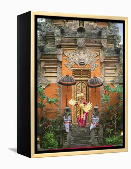 Balinese Dancer Wearing Traditional Garb Near Palace Doors in Ubud, Bali, Indonesia-Jim Zuckerman-Framed Premier Image Canvas