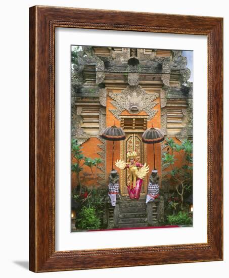 Balinese Dancer Wearing Traditional Garb Near Palace Doors in Ubud, Bali, Indonesia-Jim Zuckerman-Framed Photographic Print