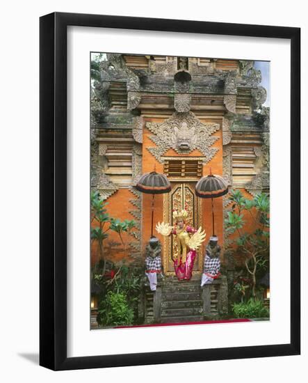 Balinese Dancer Wearing Traditional Garb Near Palace Doors in Ubud, Bali, Indonesia-Jim Zuckerman-Framed Photographic Print