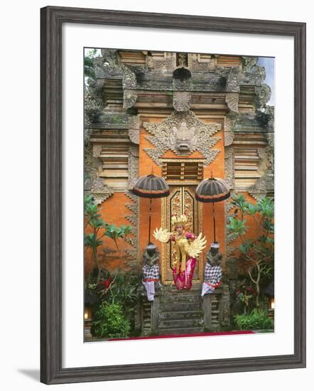 Balinese Dancer Wearing Traditional Garb Near Palace Doors in Ubud, Bali, Indonesia-Jim Zuckerman-Framed Photographic Print