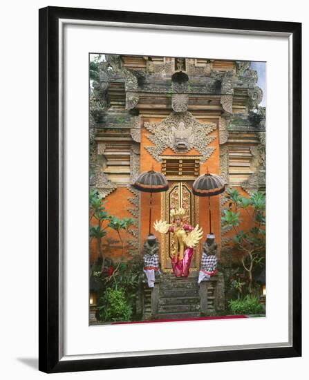 Balinese Dancer Wearing Traditional Garb Near Palace Doors in Ubud, Bali, Indonesia-Jim Zuckerman-Framed Photographic Print