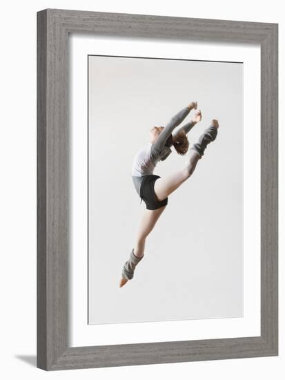 Ballerina Leaping in Mid-Air-null-Framed Photo