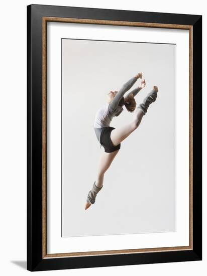 Ballerina Leaping in Mid-Air-null-Framed Photo