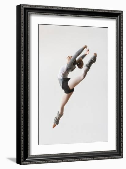 Ballerina Leaping in Mid-Air-null-Framed Photo