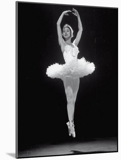 Ballerina Margot Fonteyn in White Costume Leaping into the Air While Dancing Alone on Stage-Gjon Mili-Mounted Premium Photographic Print