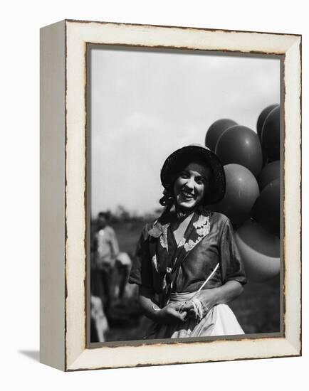 Balloon Seller-null-Framed Premier Image Canvas