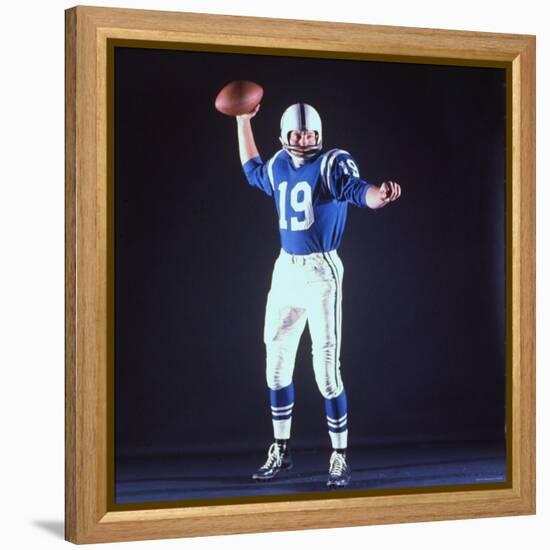 Baltimore Colts Football Player Johnny Unitas in Uniform While Holding Ball in Passing Stance-Yale Joel-Framed Premier Image Canvas