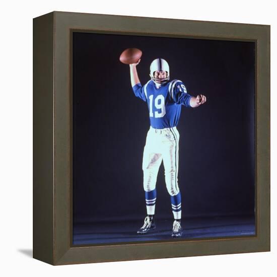 Baltimore Colts Football Player Johnny Unitas in Uniform While Holding Ball in Passing Stance-Yale Joel-Framed Premier Image Canvas