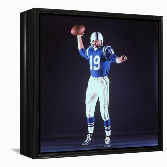 Baltimore Colts Football Player Johnny Unitas in Uniform While Holding Ball in Passing Stance-Yale Joel-Framed Premier Image Canvas