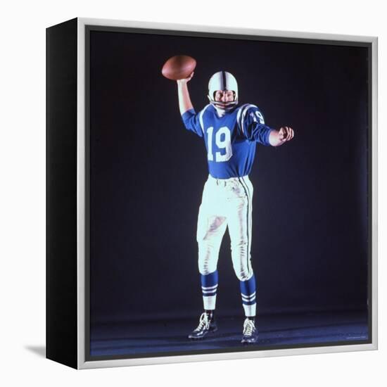 Baltimore Colts Football Player Johnny Unitas in Uniform While Holding Ball in Passing Stance-Yale Joel-Framed Premier Image Canvas