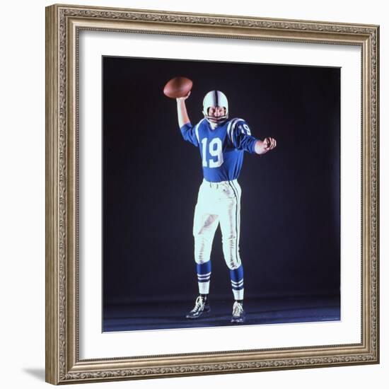 Baltimore Colts Football Player Johnny Unitas in Uniform While Holding Ball in Passing Stance-Yale Joel-Framed Premium Photographic Print