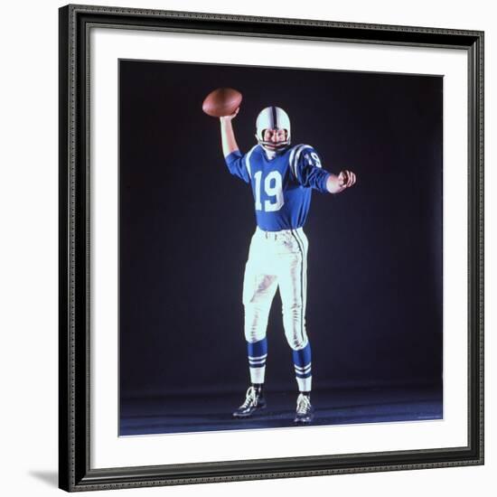 Baltimore Colts Football Player Johnny Unitas in Uniform While Holding Ball in Passing Stance-Yale Joel-Framed Premium Photographic Print