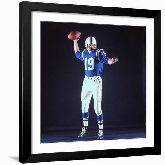 Baltimore Colts Football Player Johnny Unitas in Uniform While Holding Ball in Passing Stance-Yale Joel-Framed Premium Photographic Print