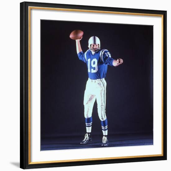 Baltimore Colts Football Player Johnny Unitas in Uniform While Holding Ball in Passing Stance-Yale Joel-Framed Premium Photographic Print