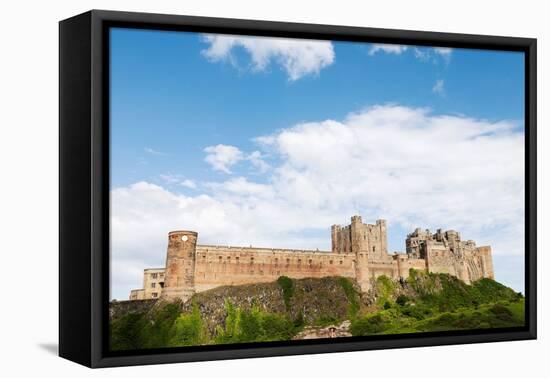 Bamburgh Castle, a fortress constructed on top of a craggy outcrop of volcanic dolerite-Stuart Forster-Framed Premier Image Canvas